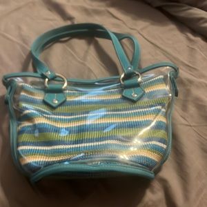 SAK purse, with removable plastic covering